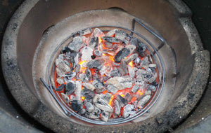 Kick Ash basket with burning charcoal